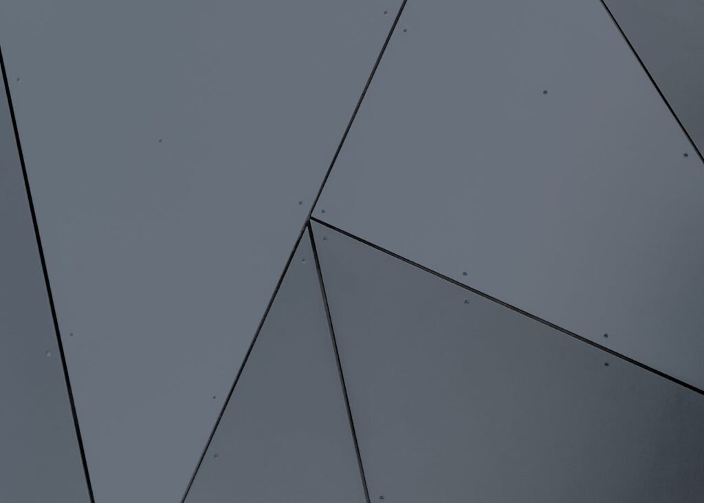 Abstract geometric facade with grey panels and sharp lines in London, Ontario.